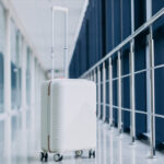 white-travel-bag-isolated-alone-by-gates (1)