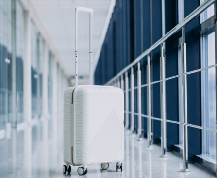 white-travel-bag-isolated-alone-by-gates (1)
