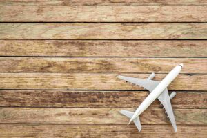 airplane-model-wooden-background-top-view-copy-space (1)