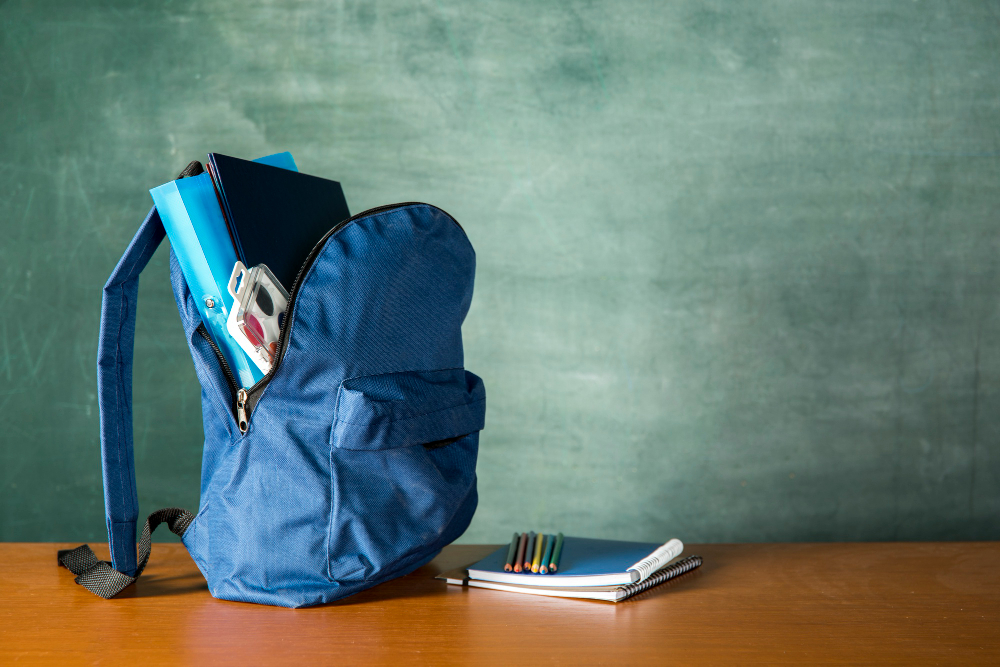 open-knapsack-with-stationery-watercolors