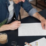 close-up-man-writing-letter-compressed (1)