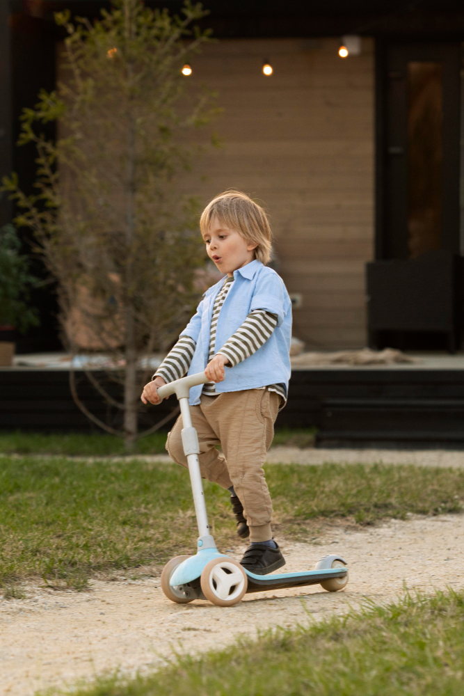 full-shot-boy-playing-with-scooter