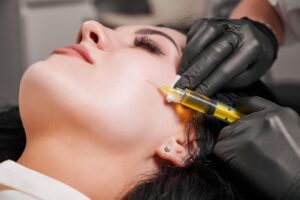 female-doctor-making-injection-woman-chin_651396-3385